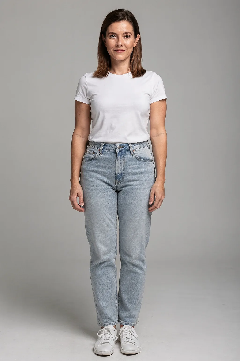 Outfit try-on input: a woman in a white t-shirt and jeans, full body, plain background