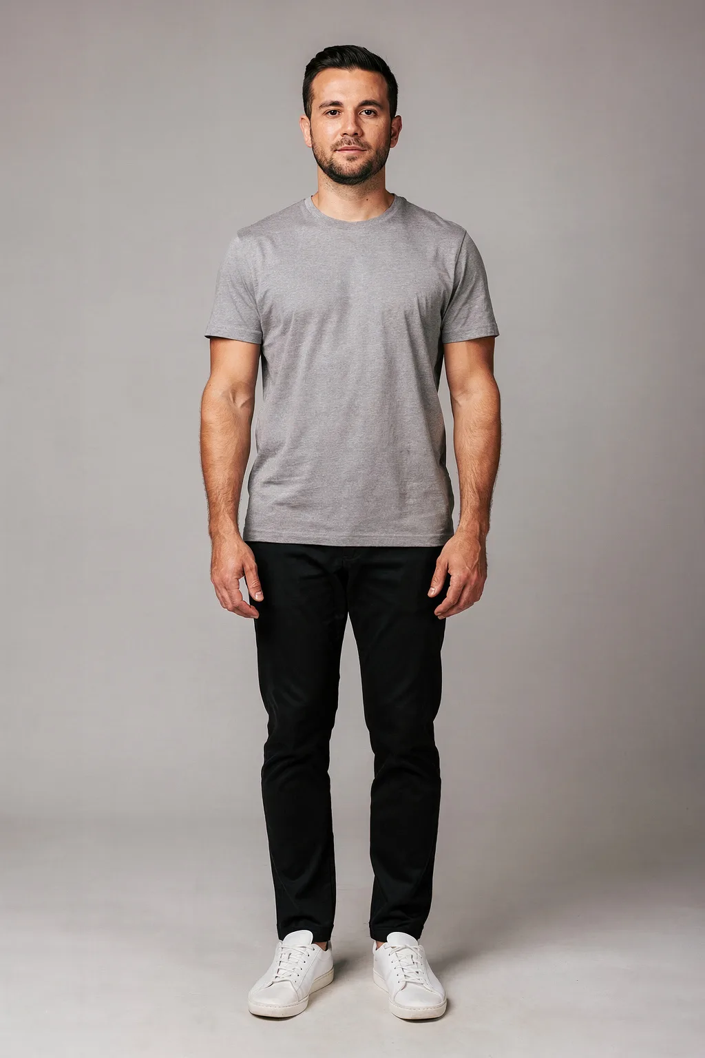 Outfit try-on input: a man in a grey t-shirt and black trousers, full body, plain background