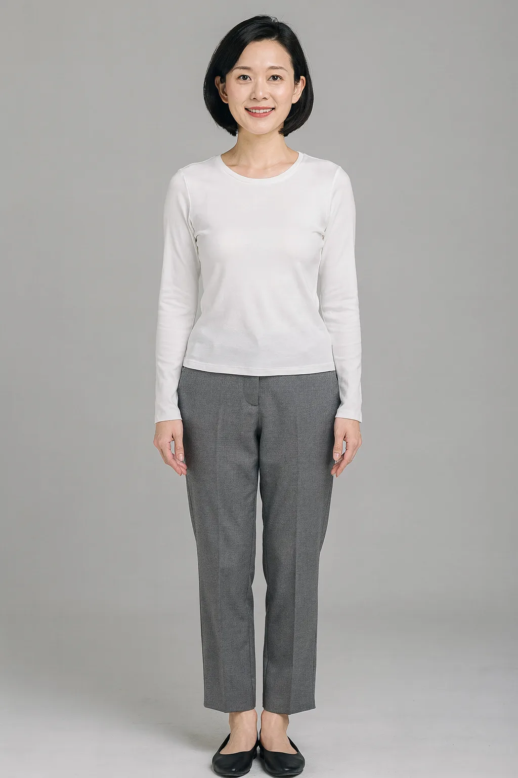Outfit try-on input: a woman in a white top and grey trousers, full body, plain background